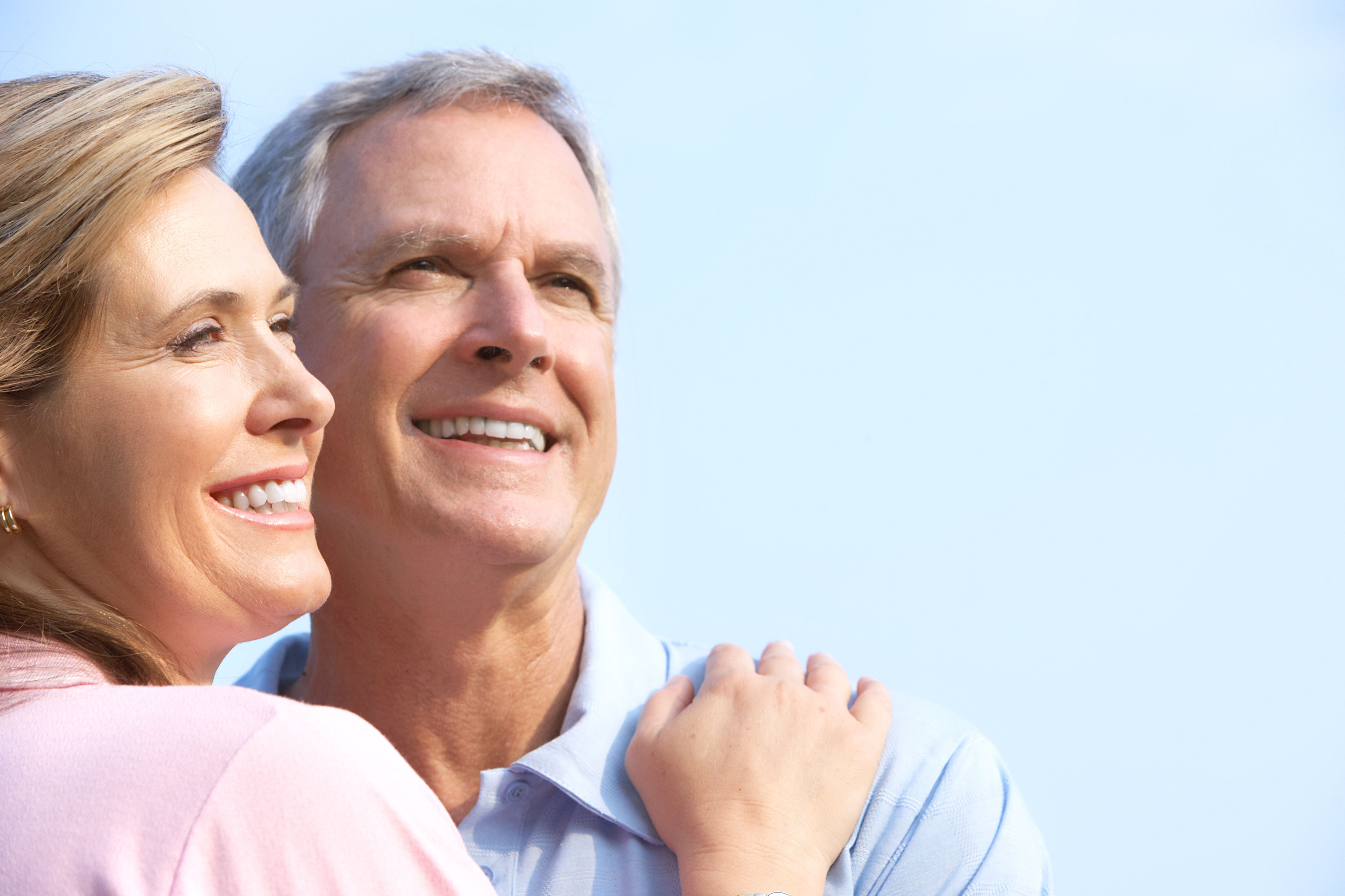 A Man and Woman Smile at Each Other